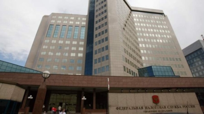 ФНС России разъяснила основания освобождения от налогообложения земельного участка под МКД